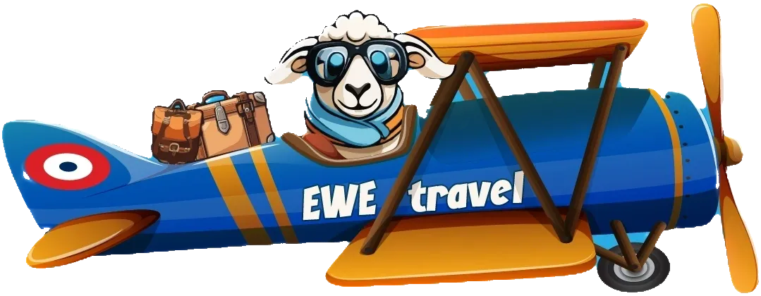 A sheep with sunglasses and goggles on top of an airplane.